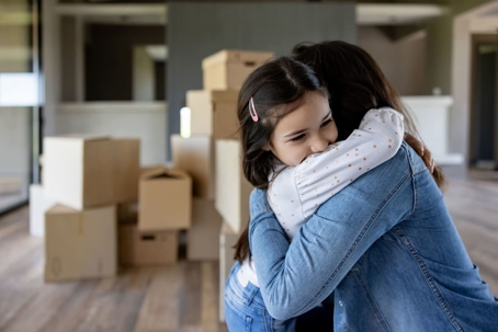 Daughter hugging her mother during a move